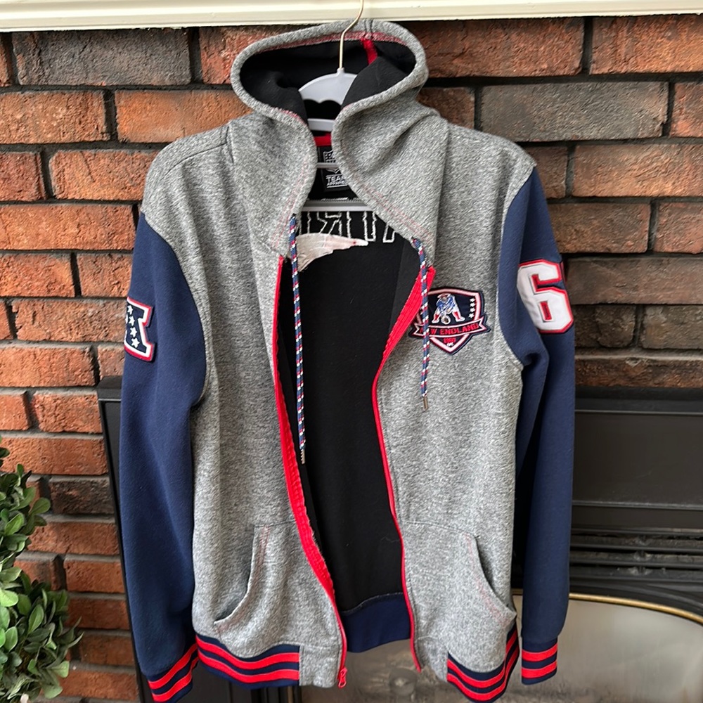 New England Patriots sweatshirt.
